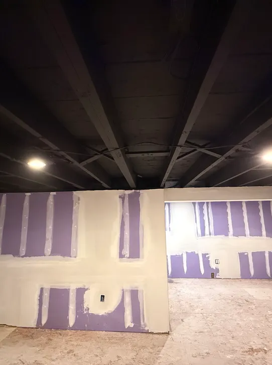 Patriot Plastering worker doing drywall