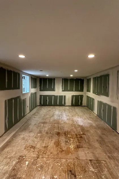 basement drywall taping in progress
