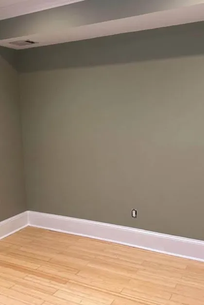 finished green room with smooth plaster walls
