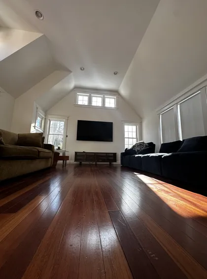 finished plastered living room with vaulted ceiling