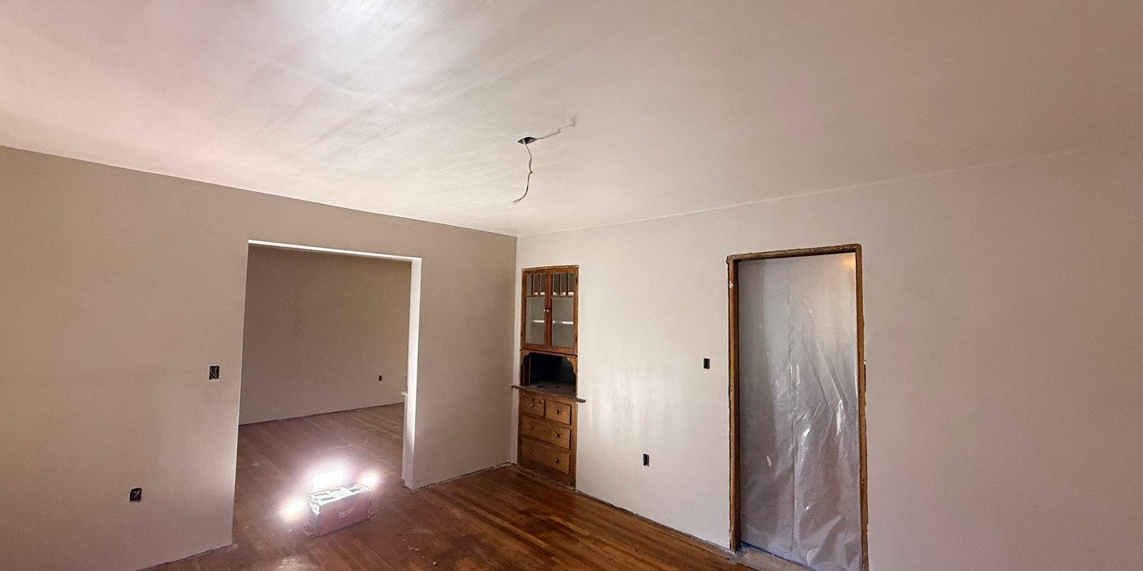 Finished room with smooth plaster walls and ceiling