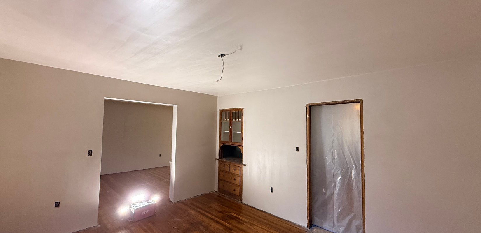 Finished room with smooth plaster walls and ceiling