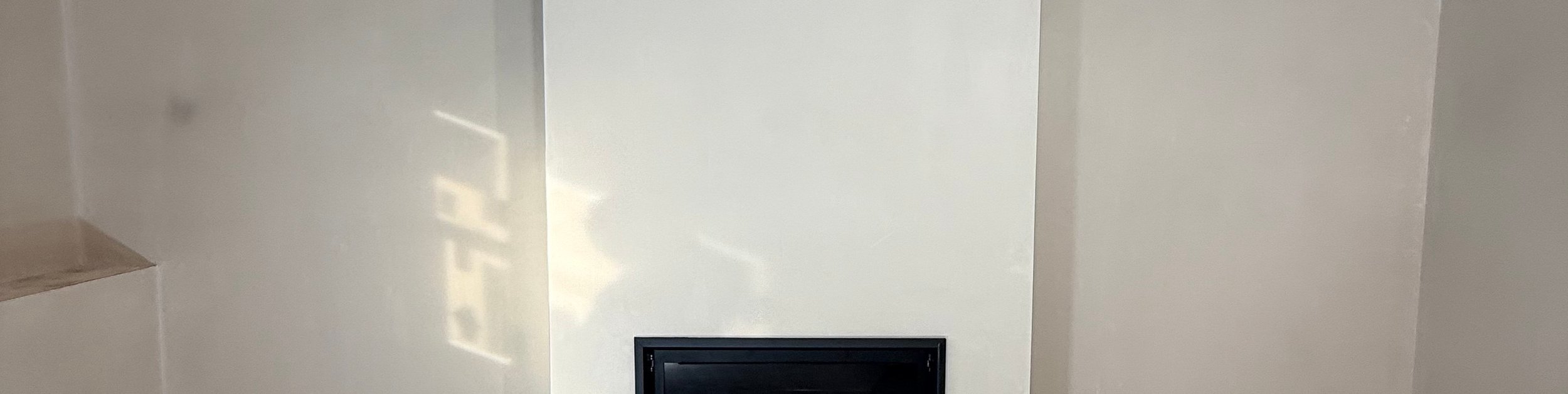smooth plastered fireplace wall
