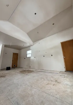 Patriot Plastering worker finishing wall