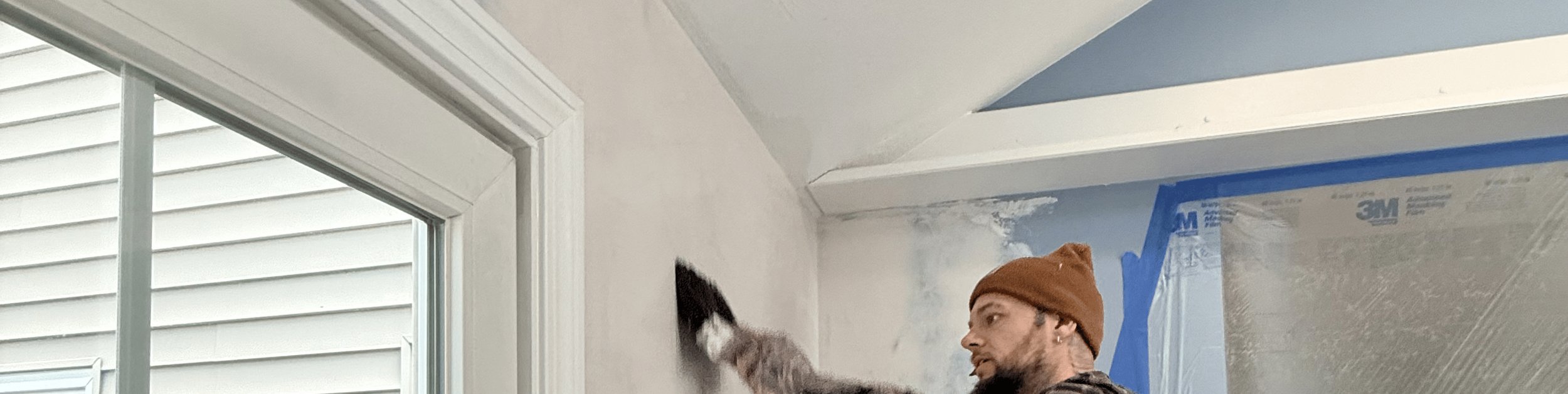 Patriot Plastering worker on repair job site