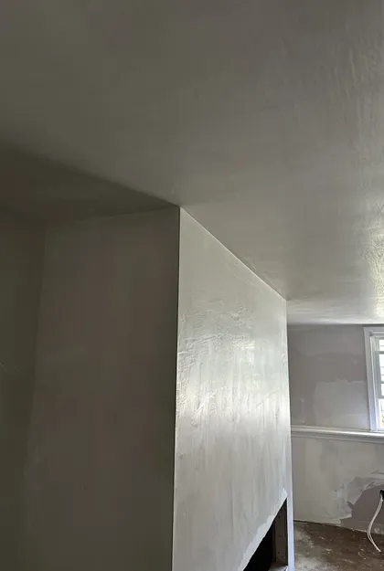 plastered fireplace and ceiling closeup