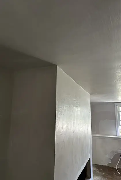 plastered fireplace and ceiling closeup