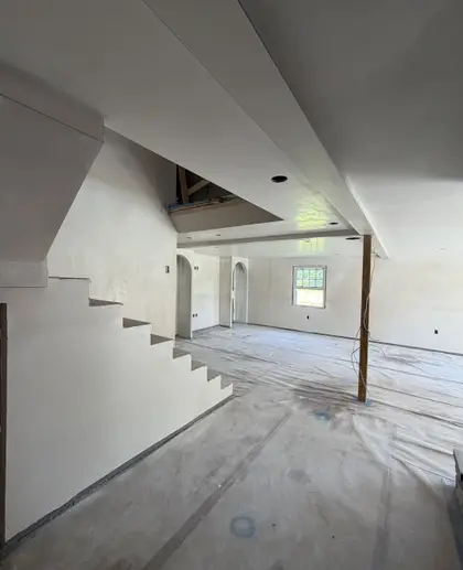 plastered staircase in an open-plan renovation