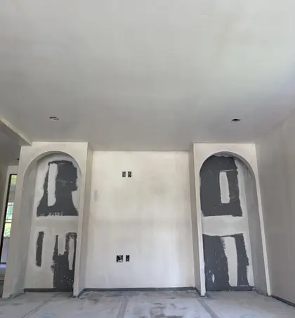 smooth plastered wall with arched openings