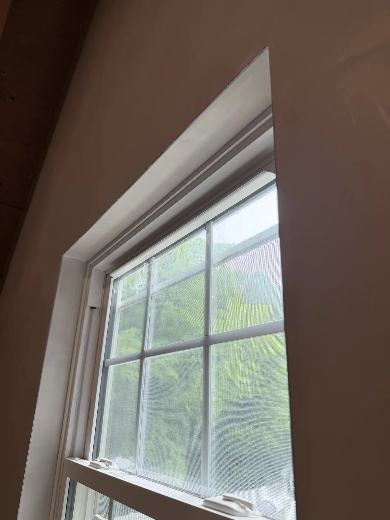 Smooth plaster reveal around an interior window