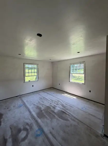 smoothly plastered room with recessed ceiling lights