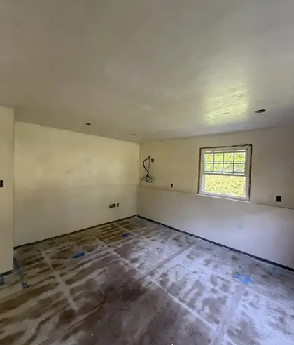 newly plastered room with smooth walls and ceiling
