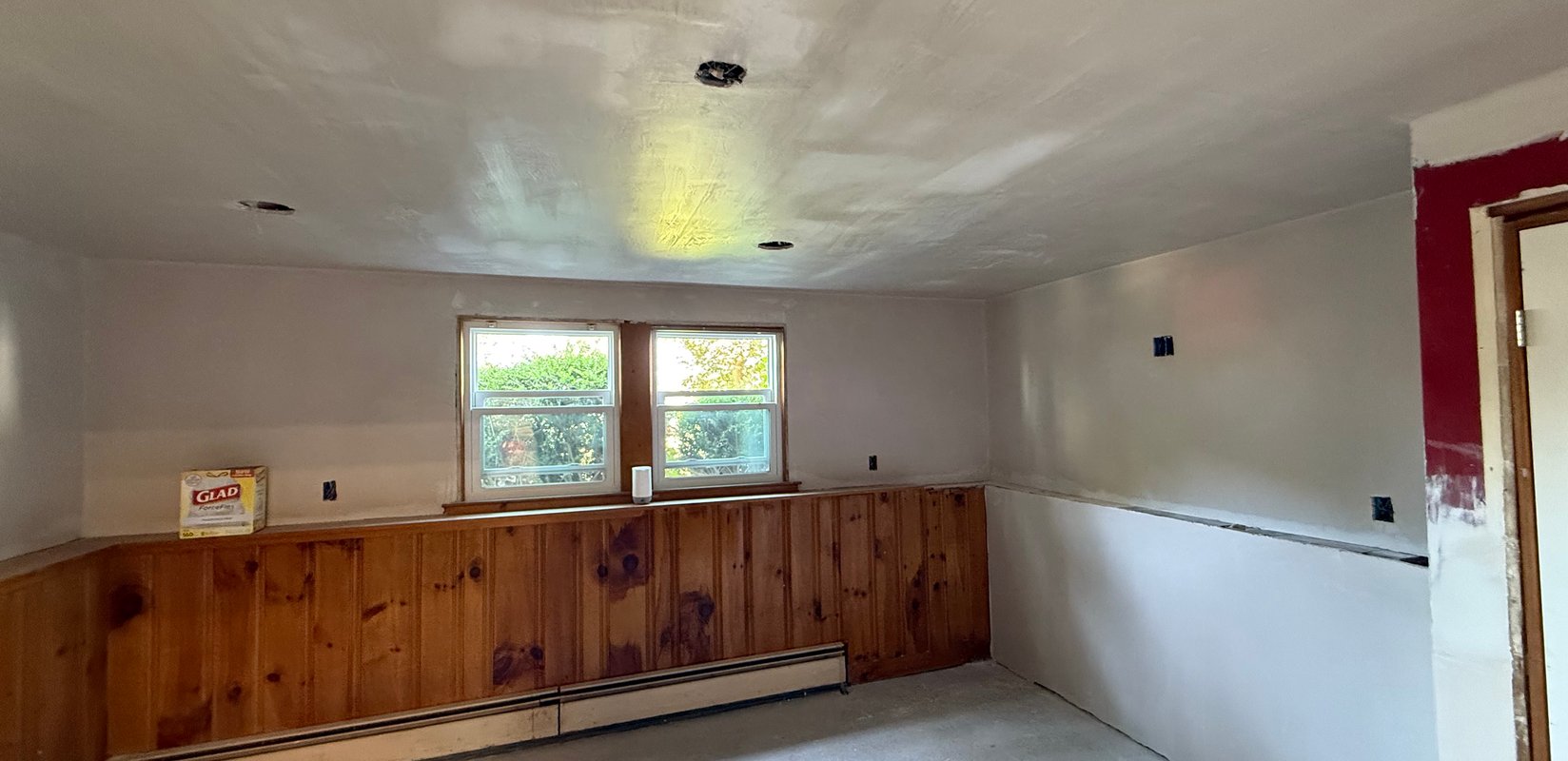 Wall and ceiling surfaces prepared during an interior repair