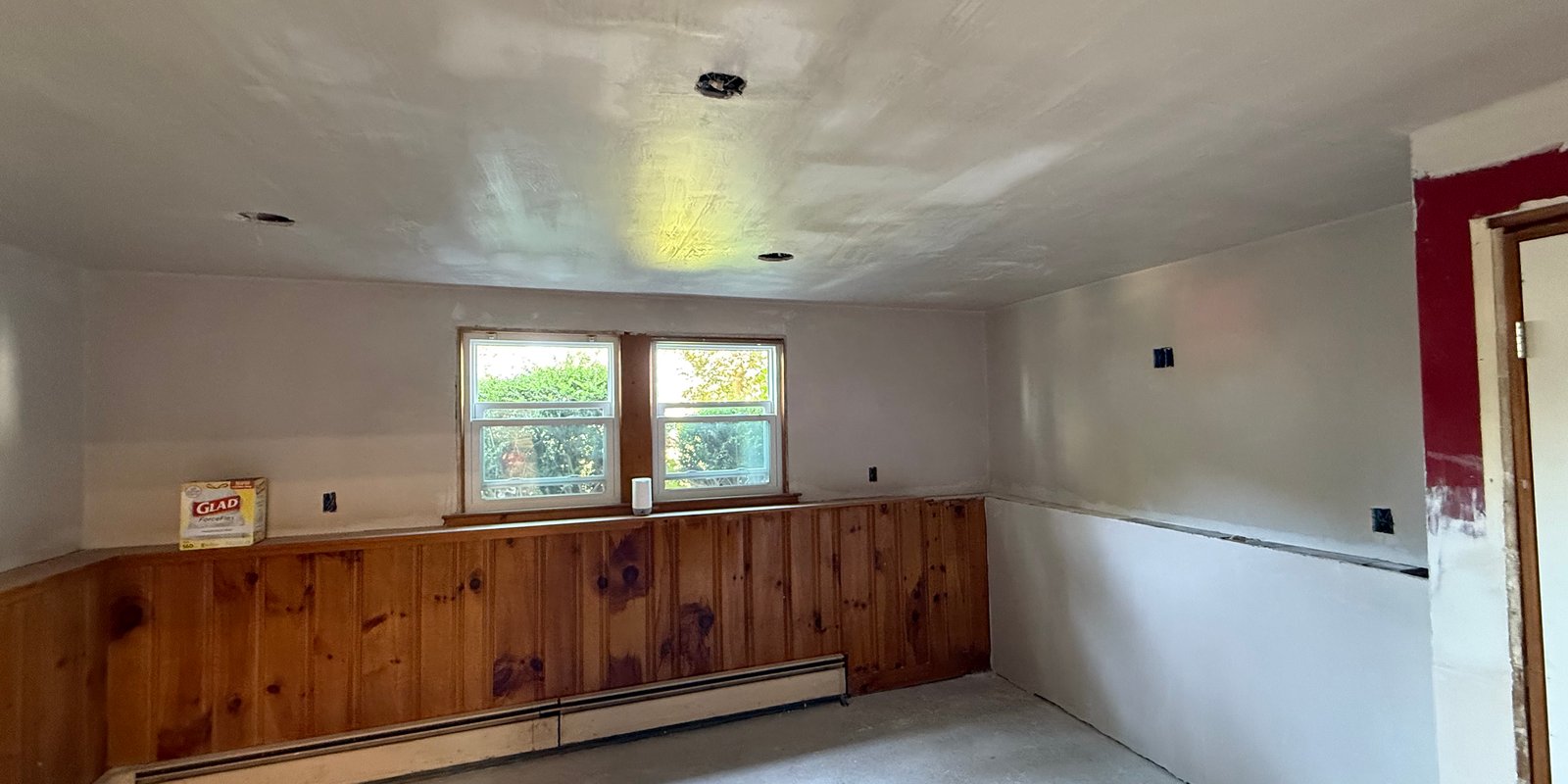 Wall and ceiling surfaces prepared during an interior repair